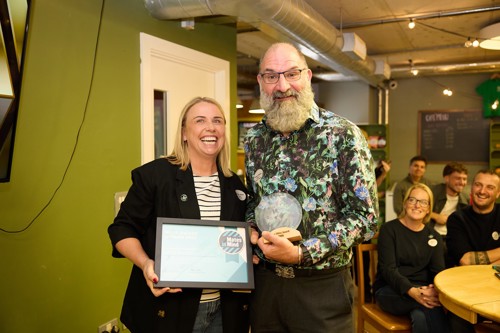 Steve Walsh receiving the Wiles Award from Michelle Wiles, Patron of Mates in Mind, at the 2025 Impact Awards